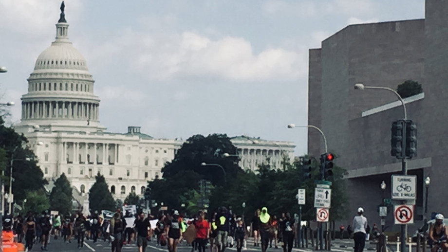 In 2021, Black Lives Matter demonstrators march through Washington to demand police accountability. [Brooke Anderson/TNA]