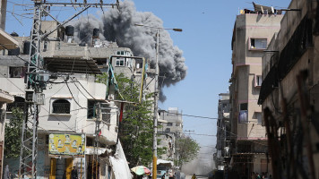 Smoke rises following an Israeli airstrike on the Bureij Refugee Camp in central Gaza, as intense Israeli bombardments continue across the region on May 23, 2025.